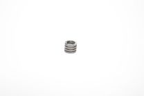 Spring for camshaft damper